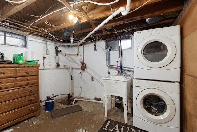 laundry area with laundry area and stacked washer and dryer