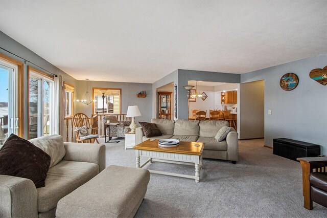 15095 N Barton Lake Dr, Vicksburg, MI 49097 - living area featuring carpet and a notable chandelier