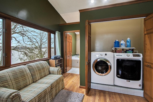 15095 N Barton Lake Dr, Vicksburg, MI 49097 - washroom featuring washer and dryer, laundry area, and light wood-type flooring