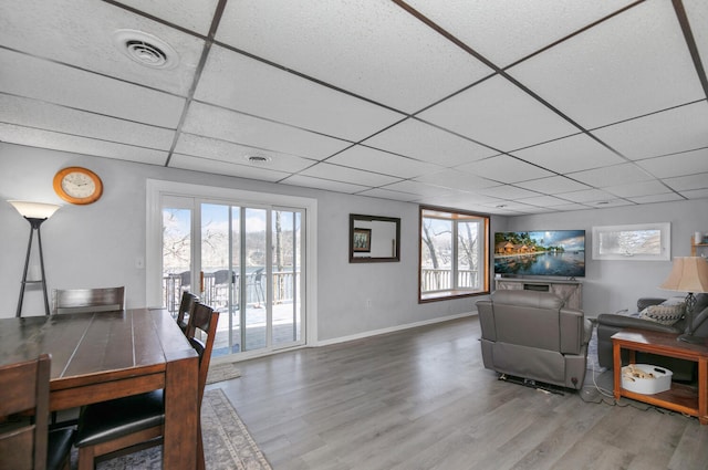 69465 High St, Union, MI 49130 - living area with a paneled ceiling, wood finished floors, plenty of natural light, and baseboards