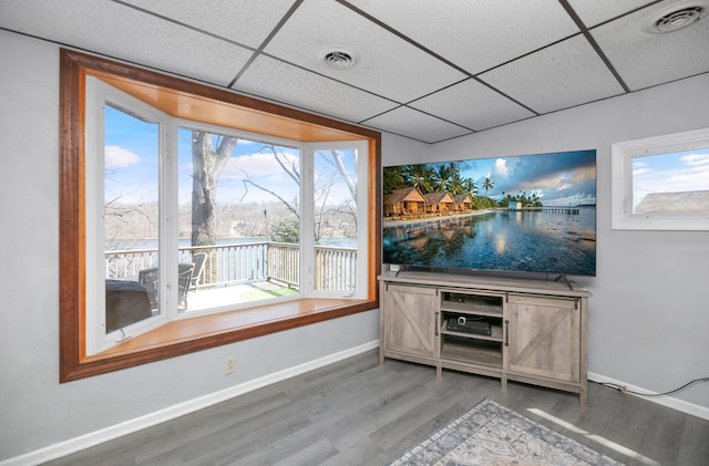 69465 High St, Union, MI 49130 - bar with a paneled ceiling, wood finished floors, and baseboards