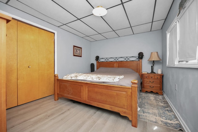 69465 High St, Union, MI 49130 - bedroom featuring light wood-style flooring and a paneled ceiling
