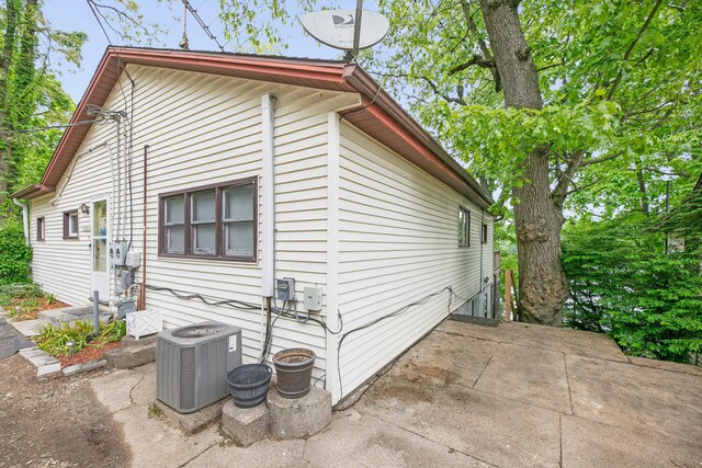 69465 High St, Union, MI 49130 - view of home's exterior featuring central AC and a patio area