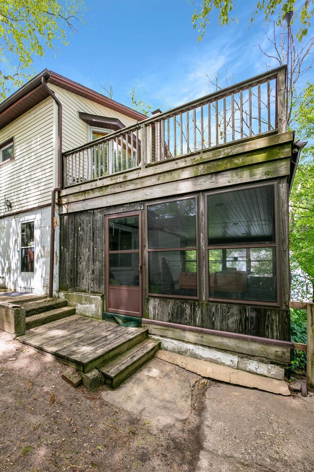 69465 High St, Union, MI 49130 - back of property featuring a sunroom and a balcony