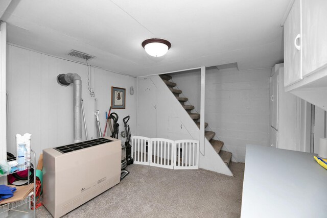 69465 High St, Union, MI 49130 - finished basement with light colored carpet, stairway, and heating unit