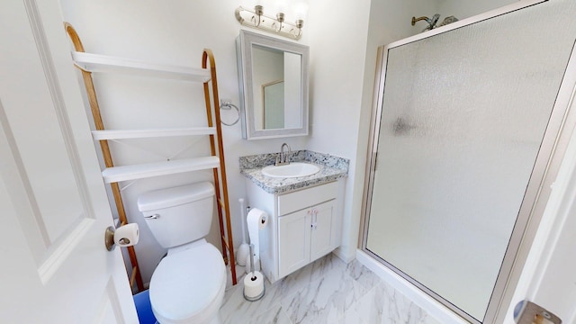 bathroom with toilet, a stall shower, marble finish floor, and vanity