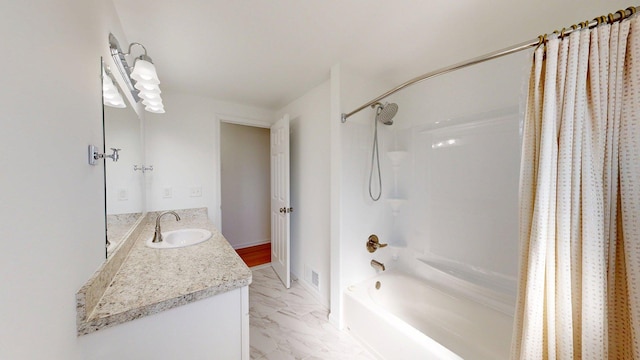 bathroom with shower / tub combo with curtain, vanity, marble finish floor, and visible vents