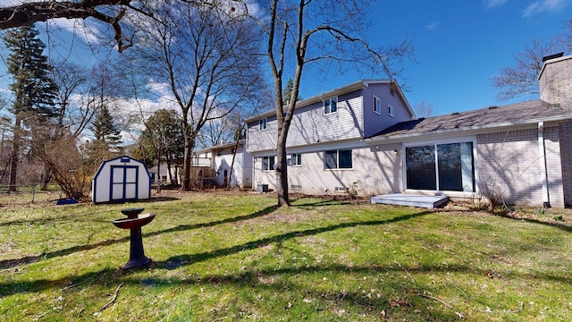 view of yard with fence, an outdoor structure, and a shed