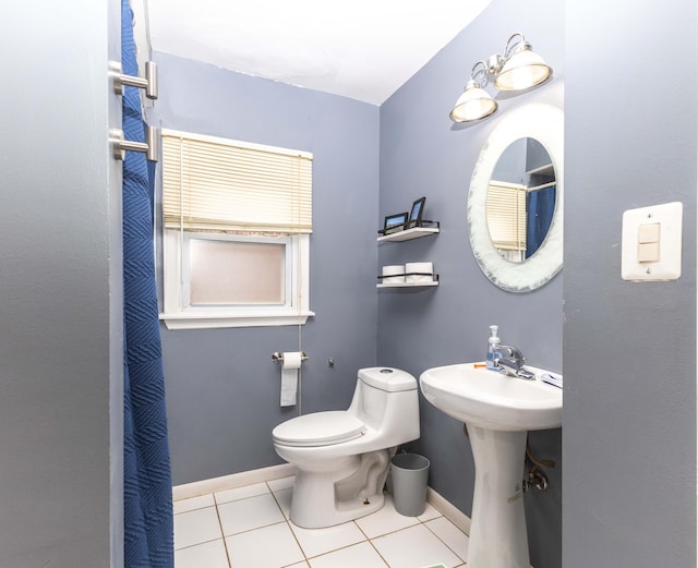full bathroom with tile patterned floors, baseboards, a sink, and toilet