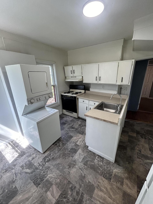 509 Mccourtie St, Kalamazoo, MI 49008 - kitchen with a sink, gas range gas stove, stacked washer / drying machine, under cabinet range hood, and white cabinetry