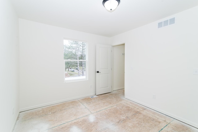 20233 Sunset Ave, Livonia, MI 48152 - empty room featuring visible vents, baseboards, and concrete flooring