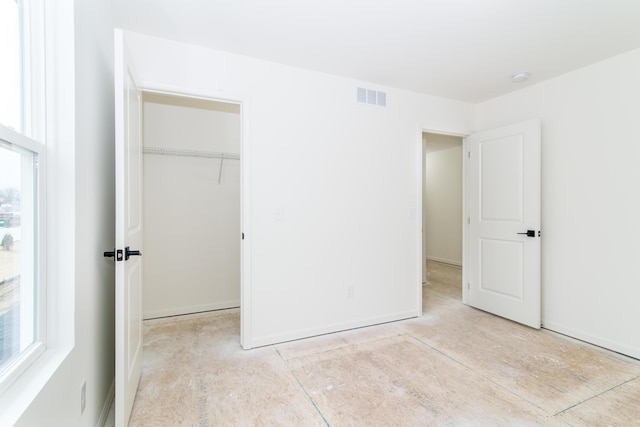 20233 Sunset Ave, Livonia, MI 48152 - unfurnished bedroom featuring visible vents and a closet