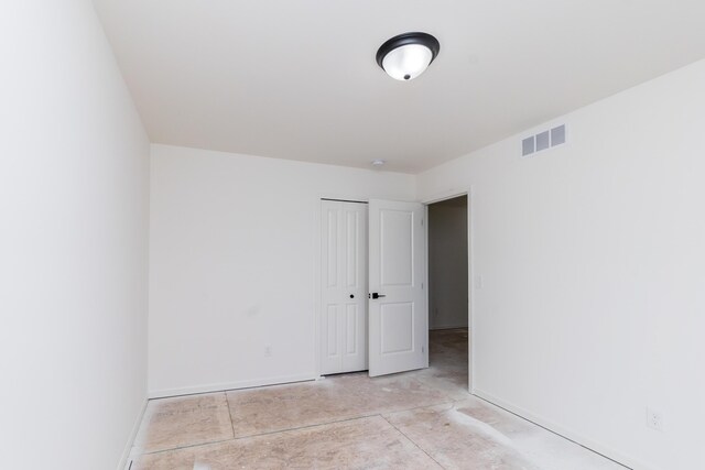 20233 Sunset Ave, Livonia, MI 48152 - empty room featuring visible vents, baseboards, and unfinished concrete flooring