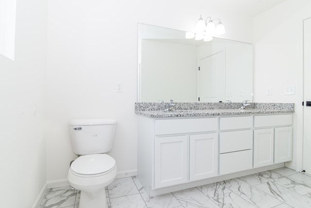20233 Sunset Ave, Livonia, MI 48152 - full bath featuring baseboards, double vanity, toilet, marble finish floor, and a sink