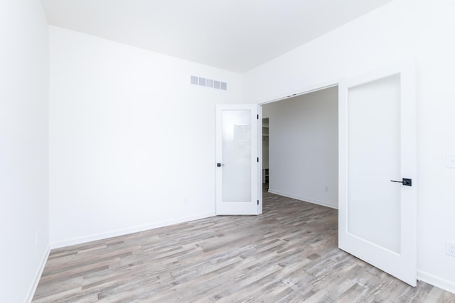 20233 Sunset Ave, Livonia, MI 48152 - unfurnished room featuring light wood-style floors, baseboards, and visible vents