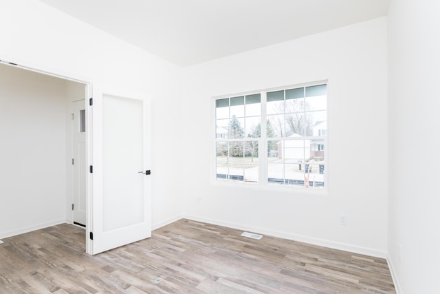 20233 Sunset Ave, Livonia, MI 48152 - unfurnished room featuring light wood-style floors, baseboards, and visible vents