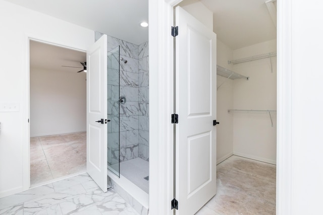 20233 Sunset Ave, Livonia, MI 48152 - bathroom featuring a shower stall, a walk in closet, marble finish floor, and baseboards
