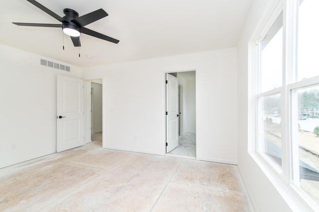 20233 Sunset Ave, Livonia, MI 48152 - unfurnished bedroom with baseboards, visible vents, multiple windows, and a ceiling fan