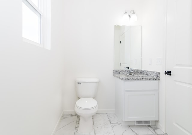 20233 Sunset Ave, Livonia, MI 48152 - half bathroom with vanity, marble finish floor, baseboards, and toilet