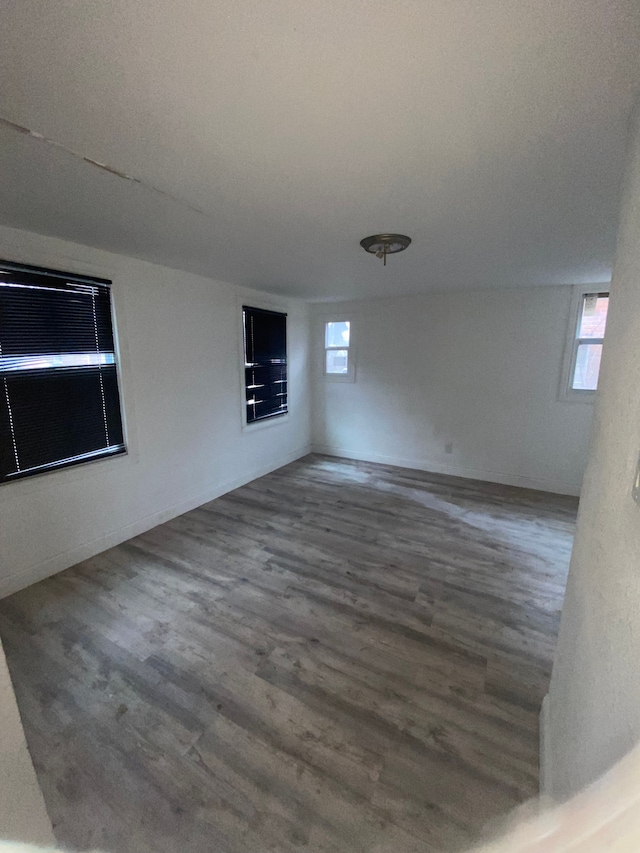 spare room featuring wood finished floors