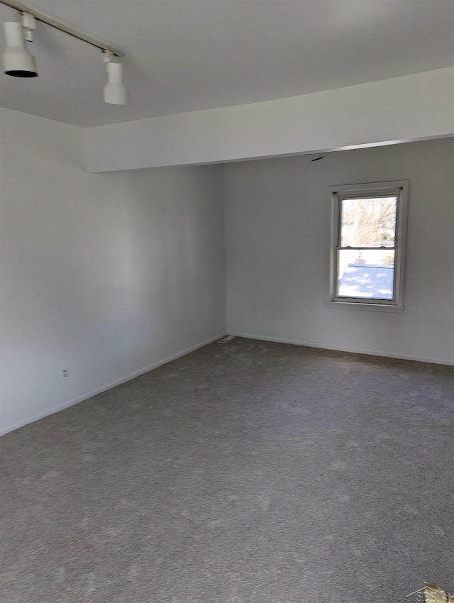 921 S Fayette St, Saginaw, MI 48602 - carpeted spare room featuring track lighting