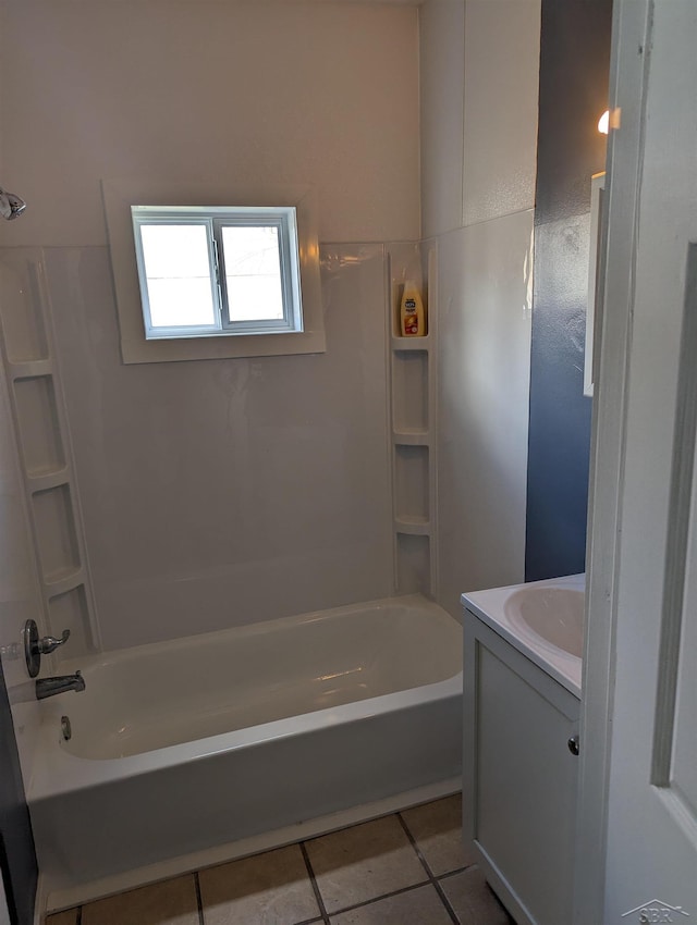 921 S Fayette St, Saginaw, MI 48602 - bathroom with tile patterned floors, vanity, and shower / washtub combination