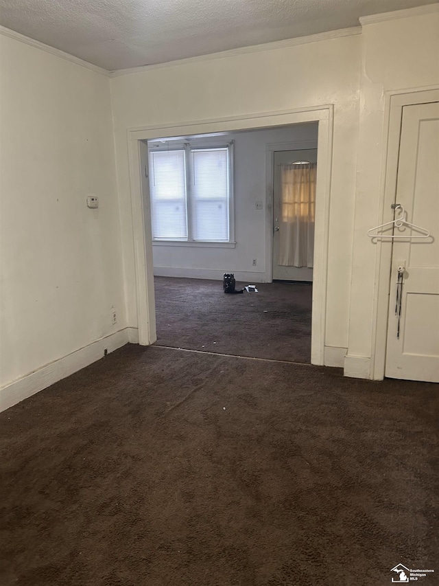 455 Kitchener St, Detroit, MI 48215 - unfurnished room with dark colored carpet, crown molding, and baseboards
