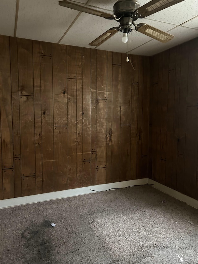 455 Kitchener St, Detroit, MI 48215 - carpeted spare room with wood walls and a ceiling fan