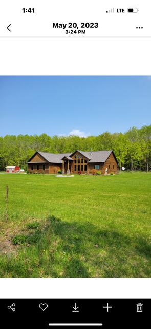view of yard featuring a wooded view