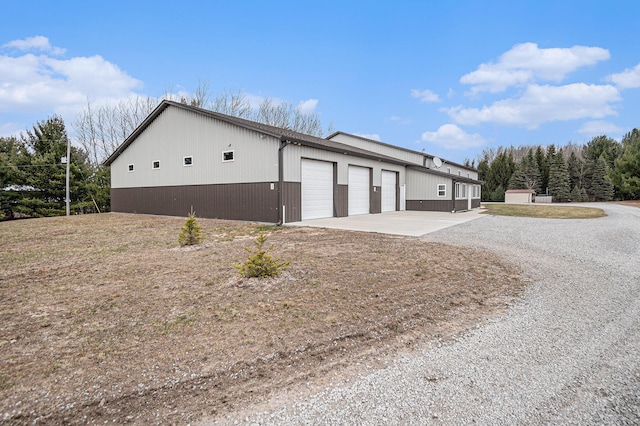 view of side of property with driveway