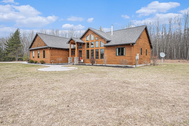 rustic home with a front lawn and a shingled roof