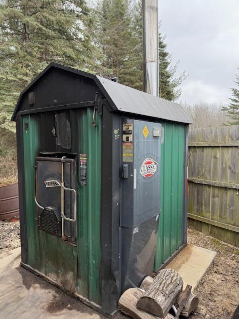 view of shed with fence