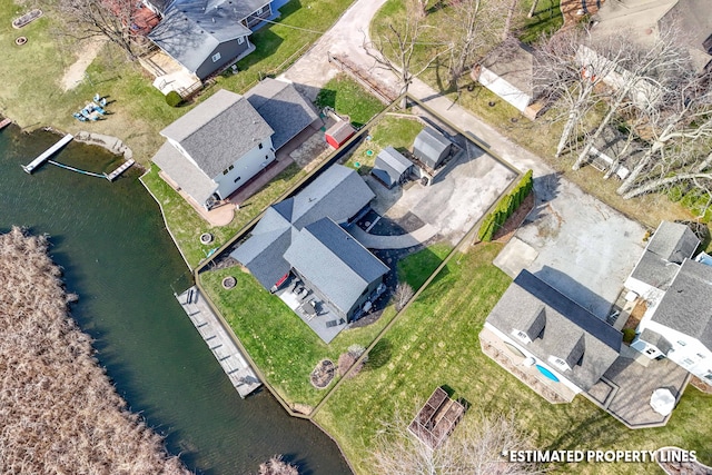 drone / aerial view featuring a residential view and a water view