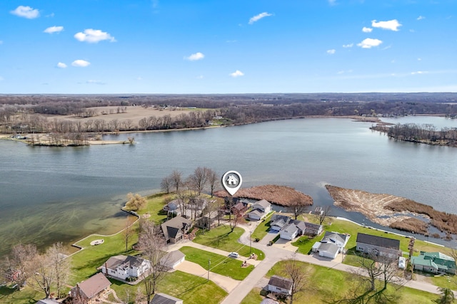 birds eye view of property with a water view and a residential view