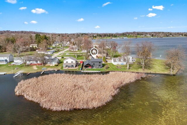 aerial view featuring a water view and a residential view