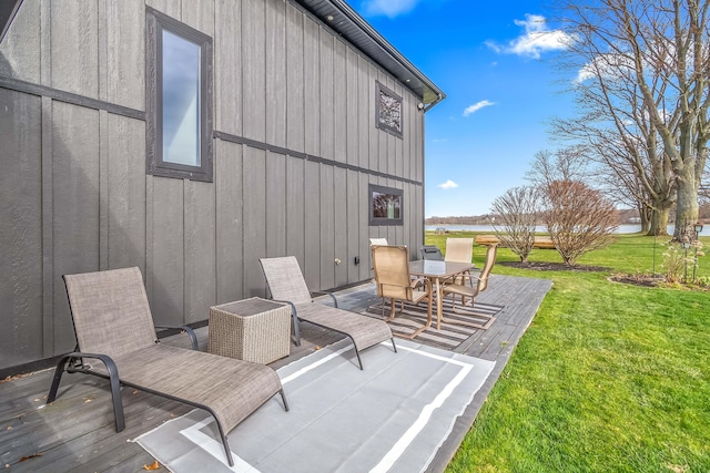 view of patio with outdoor dining space and a deck