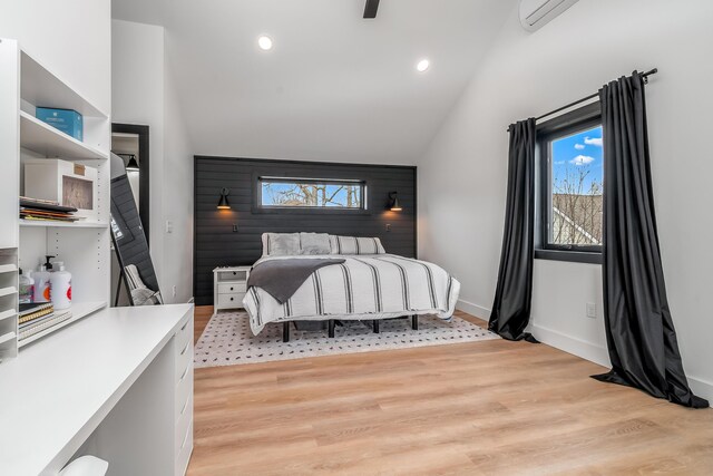bedroom with light wood-style flooring, baseboards, lofted ceiling, and recessed lighting