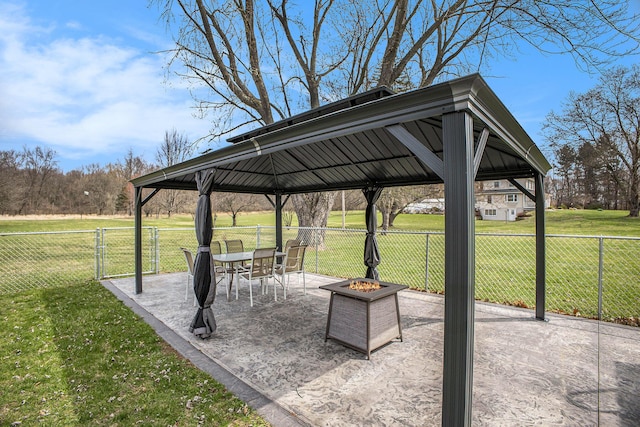 surrounding community featuring a yard, a fire pit, a patio area, a gazebo, and fence