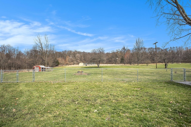 view of yard featuring fence and a gate