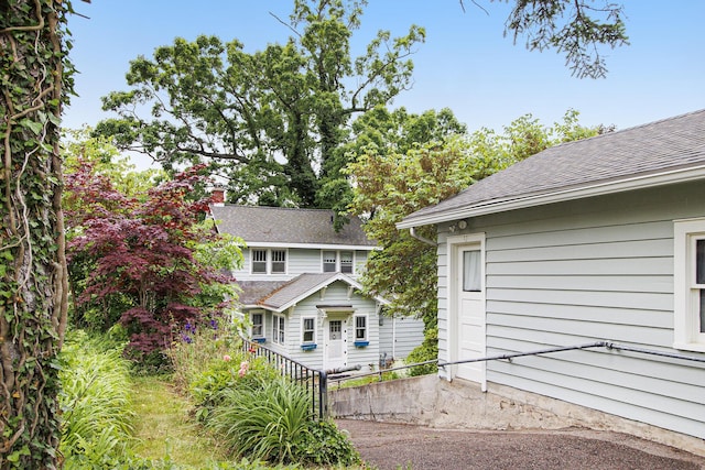 165 Honey Ln, Battle Creek, MI 49015 - back of property with a shingled roof