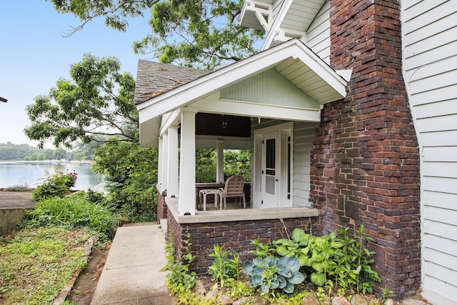 165 Honey Ln, Battle Creek, MI 49015 - entrance to property featuring a water view and covered porch