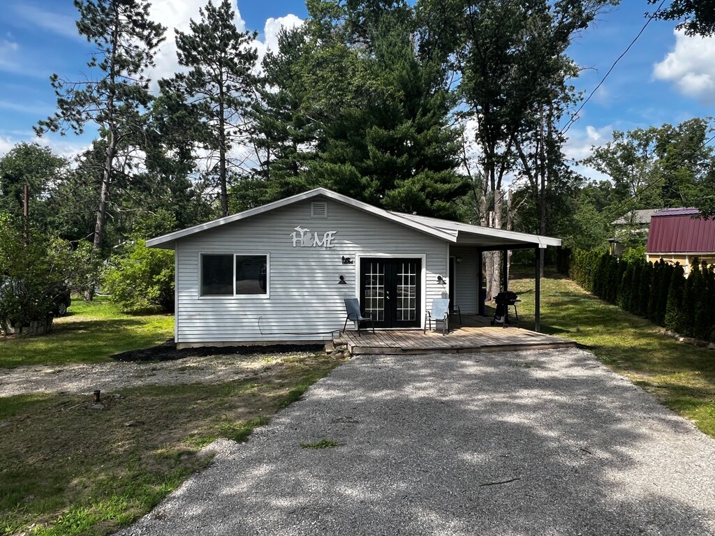 exterior space featuring aphalt driveway and fence