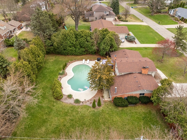 birds eye view of property with a residential view