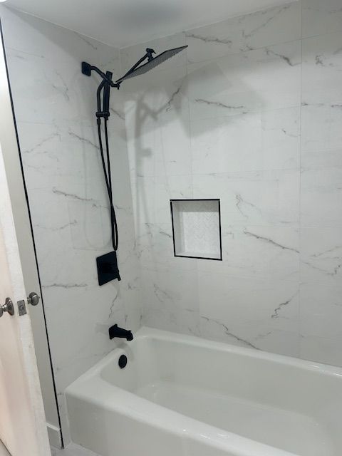 bathroom with shower / bathtub combination