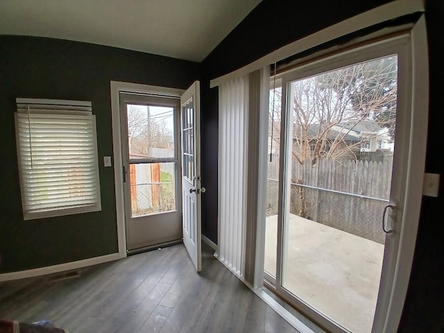 20446 Williamson St, Clinton Township, MI 48035 - doorway to outside featuring wood finished floors, baseboards, and lofted ceiling