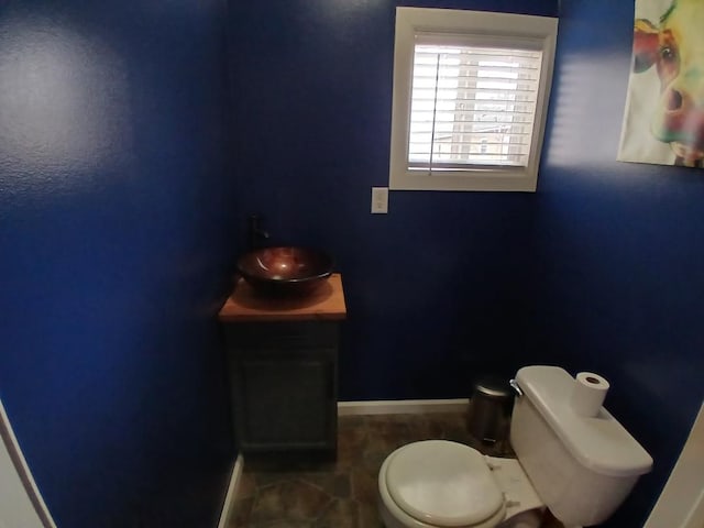 20446 Williamson St, Clinton Township, MI 48035 - half bathroom with vanity, toilet, and baseboards