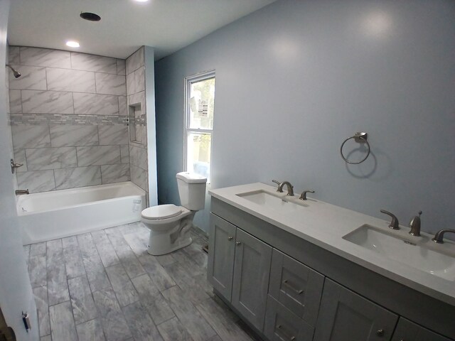 20446 Williamson St, Clinton Township, MI 48035 - bathroom with toilet, double vanity, shower / washtub combination, and wood finished floors
