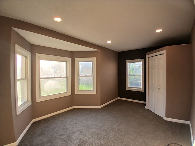 20446 Williamson St, Clinton Township, MI 48035 - unfurnished bedroom with dark colored carpet, baseboards, recessed lighting, and a closet