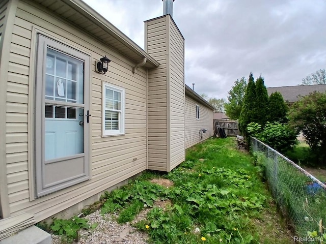 20446 Williamson St, Clinton Township, MI 48035 - view of property exterior with a chimney