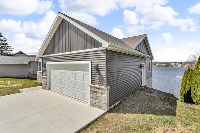 view of property exterior with a water view, roof with shingles, and stone siding